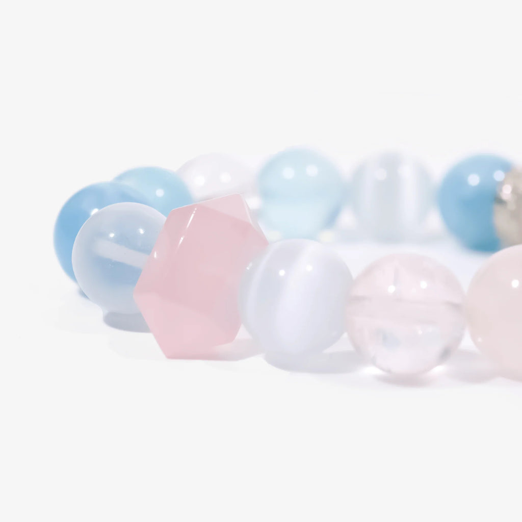 Aquamarine and rose quartz crystal bracelet beads close-up detail