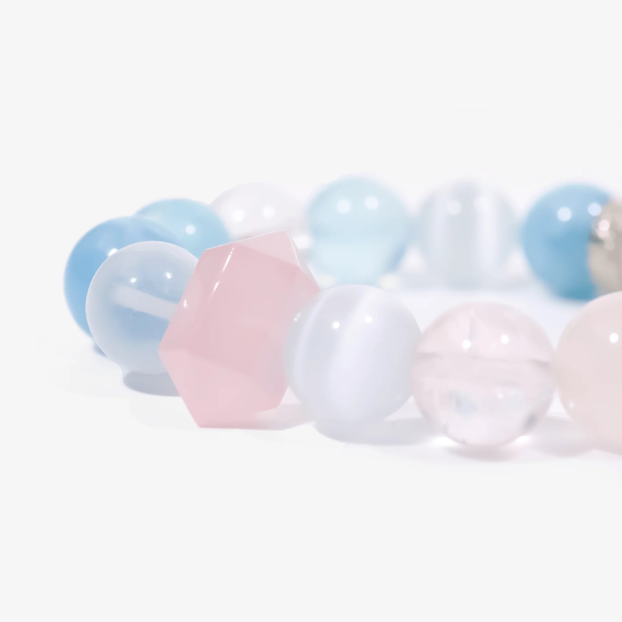 Aquamarine and rose quartz crystal bracelet beads close-up detail