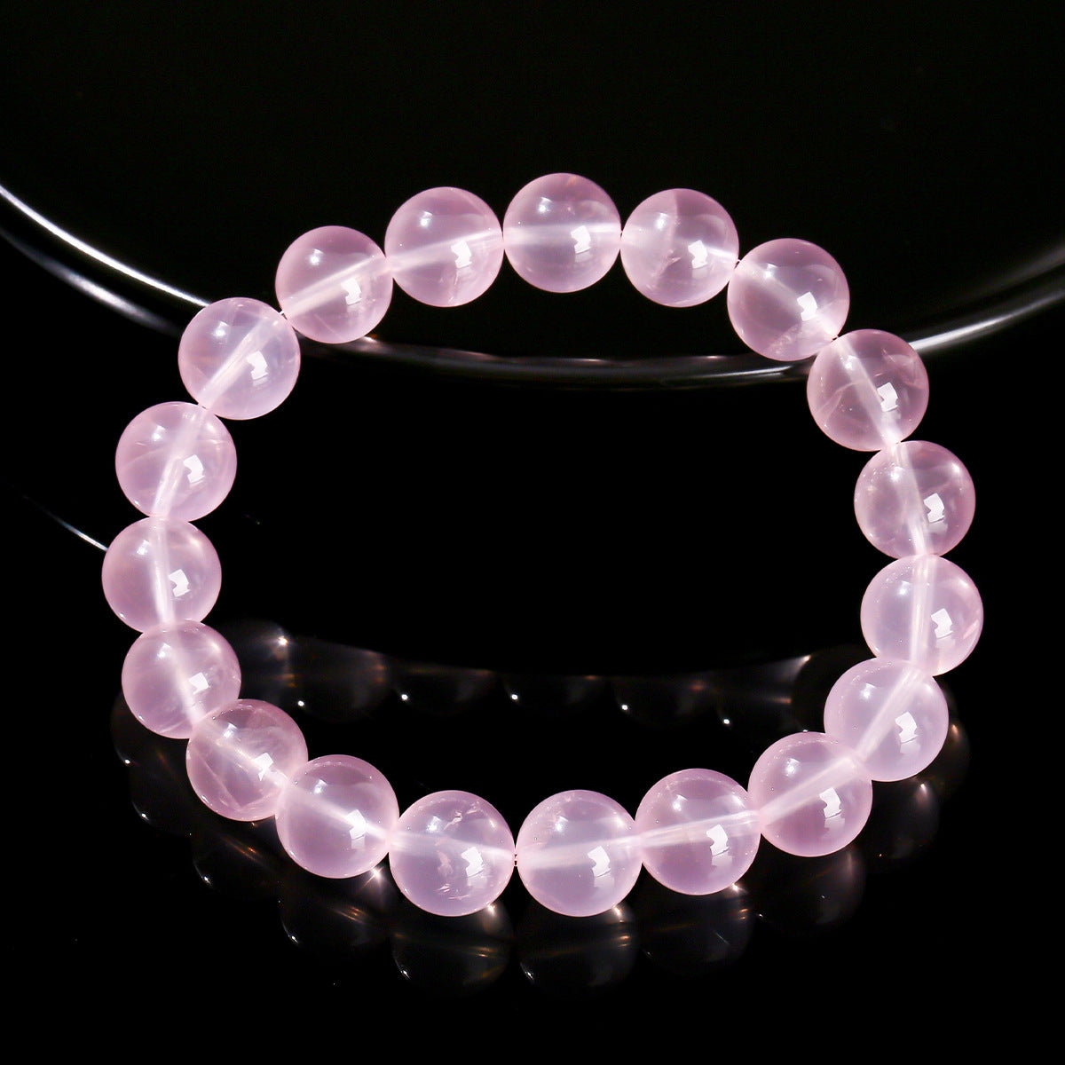 natural-star-rose-quartz-bracelet-wrist-love-crystal black background